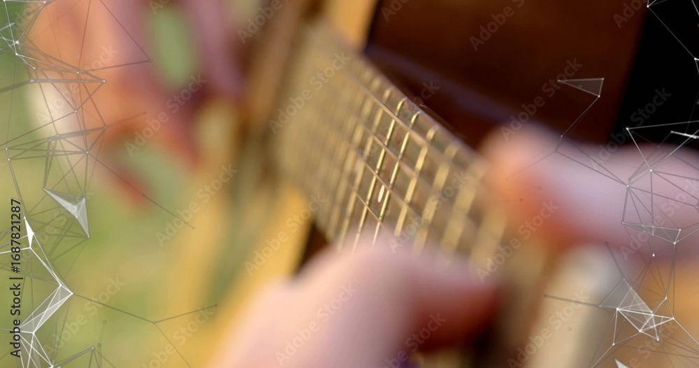 Naklejka premium Pressing musician's fingers playing chords on acoustic guitar fretboard in yard, with overlay