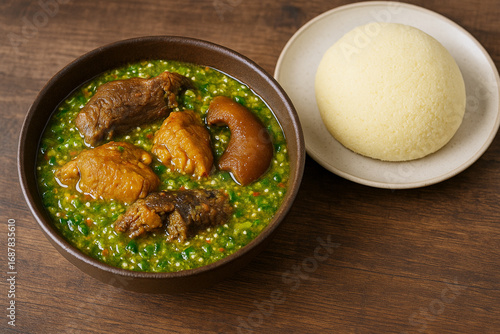 Nigerian Okra soup with garri stock photo