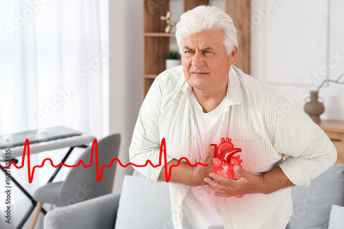 Mature man having heart att...