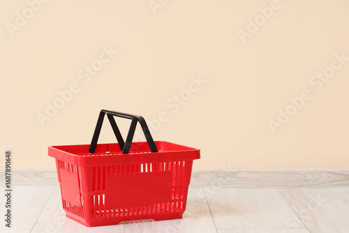 Red shopping basket near be...