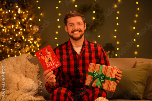 Young man with Christmas gr...