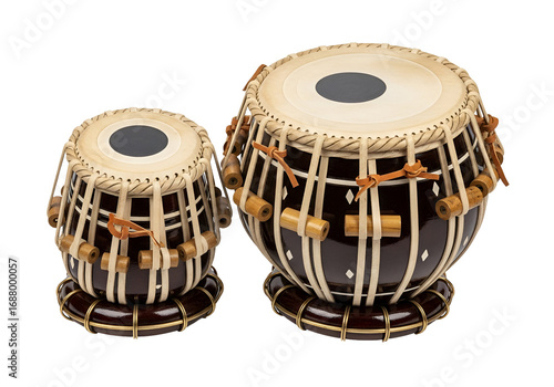 Two traditional Indian tabla drums, dark brown with cream-colored accents, stand against a black backdrop.