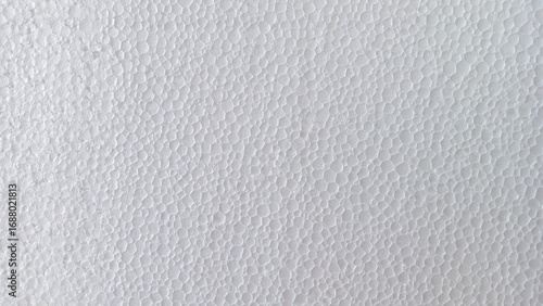 White expanded polystyrene foam sheet texture with a porous, bumpy surface, a versatile abstract background.