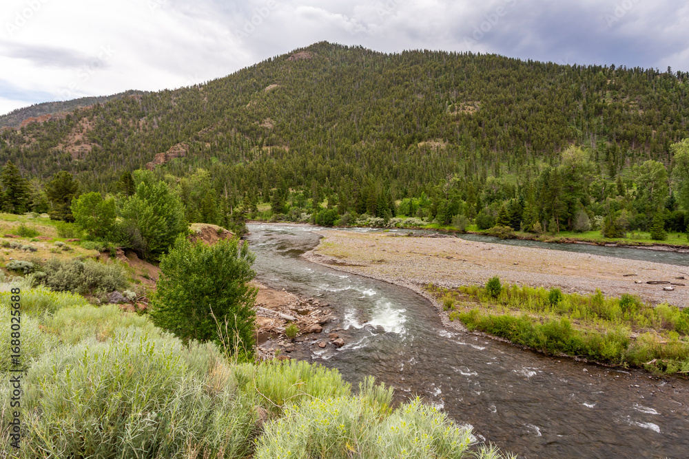 Obraz premium Mountain and river landscape in wilderness. Location Yellowstone National Park in Wyoming