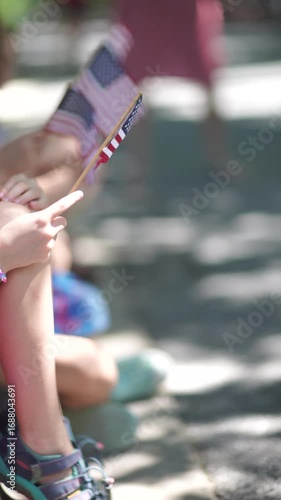 vertical video of american flag waving at parade