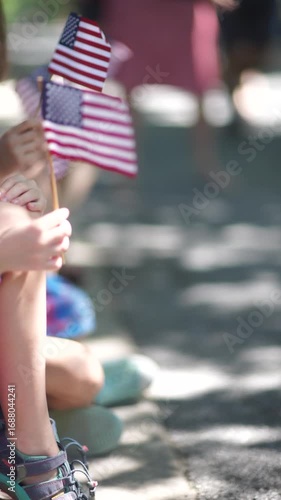 vertical video of american flag waving at parade
