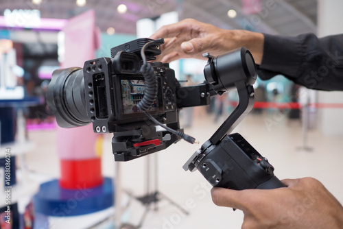 Camera man at Work using camera on stabilizer gimbal