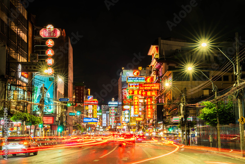CHINATOWN, BANGKOK, THAILAND - October 26, 2025 : View on people and traffic pass by in Chinatown Bangkok Thailand ,Cars and Street food on Yaowarat road.