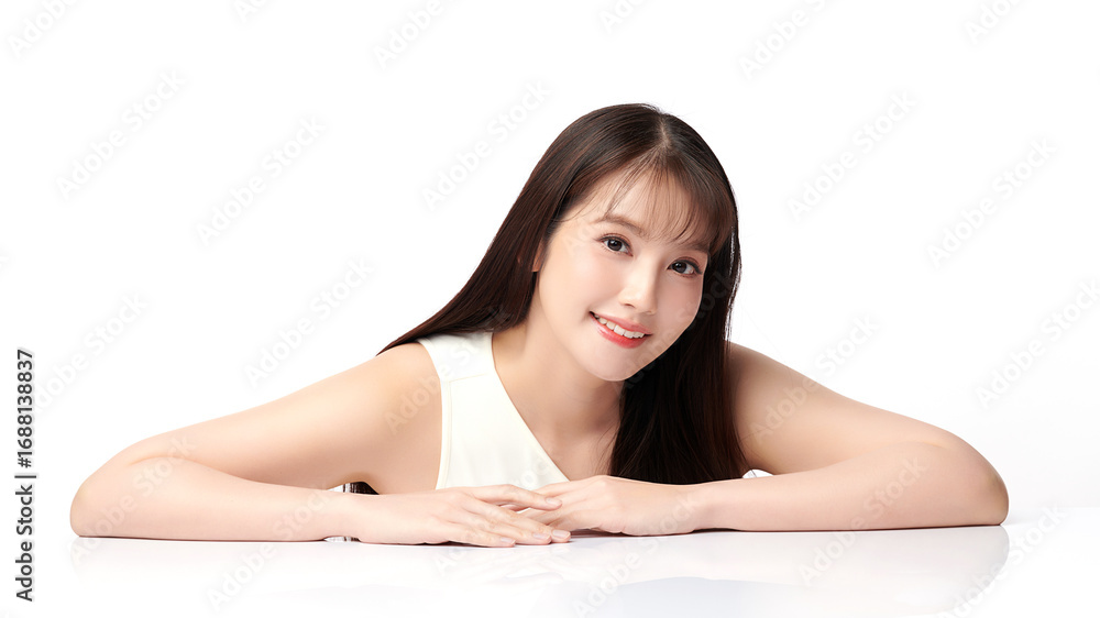 Fototapeta premium A beautiful young Asian woman with clean, fresh skin against a white background. Skincare, facial treatment, cosmetology, beauty, and spa. An elegant portrait of an Asian woman.