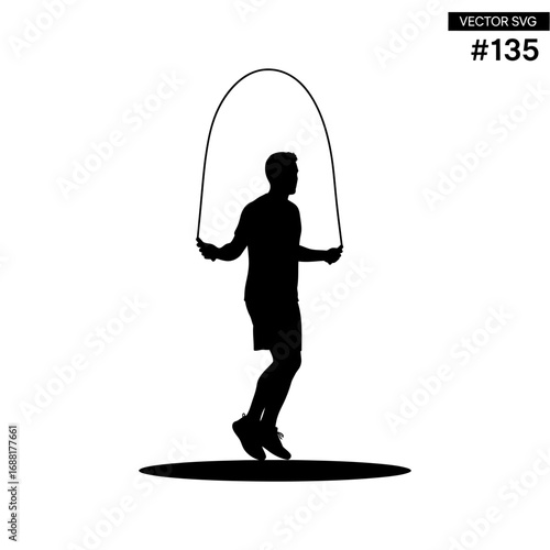 Energetic man silhouetted while jumping rope for a dynamic fitness workout, capturing active lifestyle and exercise motivation