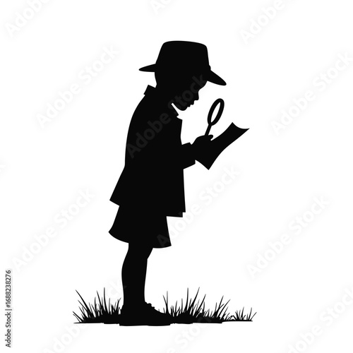 Child detective with magnifying glass examining paper in grass silhouette