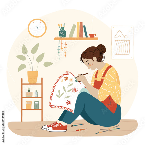 Creative young woman enjoying her artistic hobby at home.