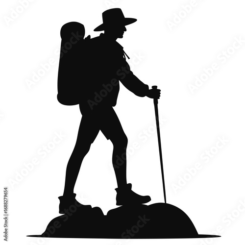 Silhouette of hiker with backpack and trekking pole on rocks 5