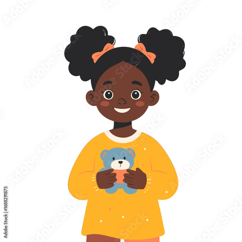 Cheerful Dark Skinned Girl with Brown Eyes Holding Blue Teddy Bear Wearing Mustard Top Against White Background Studio Shot