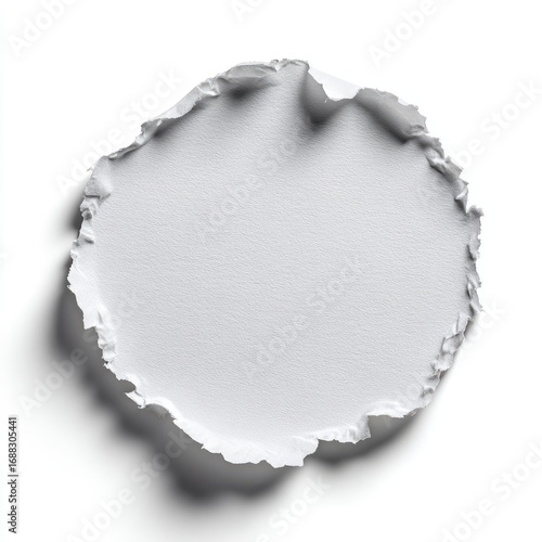 Circular torn paper cutout on white background