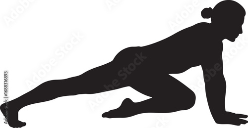 A strong silhouette of a woman performing a mountain climber exercise, showcasing core strength and fitness