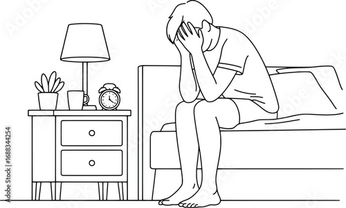 Man sitting on bed in distress holding head in hands bedroom scene