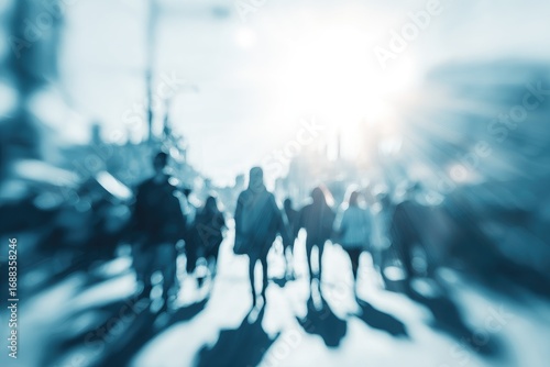 Wallpaper Mural Abstract blurred image of pedestrians walking down a city street with a bright sunlight creating a dynamic perspective in soft blue hues Torontodigital.ca
