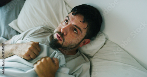 Φωτογραφία Insomnia, man and anxiety from drug addiction in bed with withdrawal symptoms, restless or craving