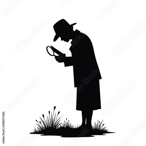 Silhouette of detective with magnifying glass examining grass