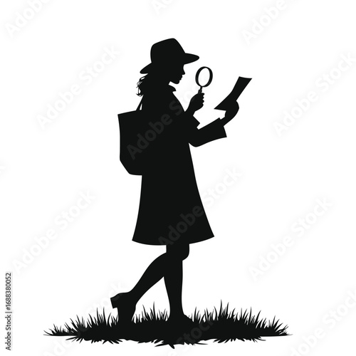 Woman in hat with magnifying glass examining paper