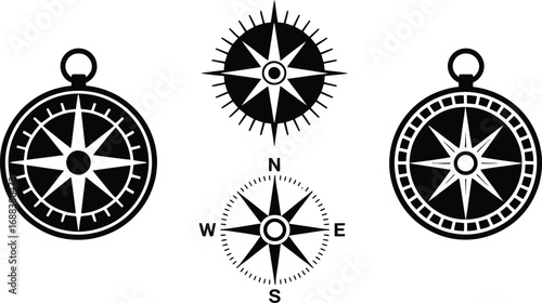 A collection of four compass rose designs in black and white with varying styles and orientations