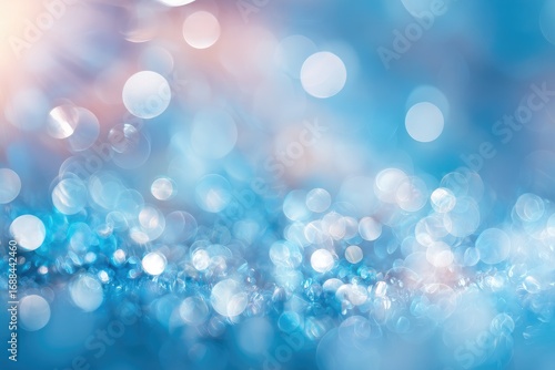 Abstract image showing a dreamy, out-of-focus scene with soft, round bokeh lights in shades of blue, white, and hints of peach creating a blurred texture