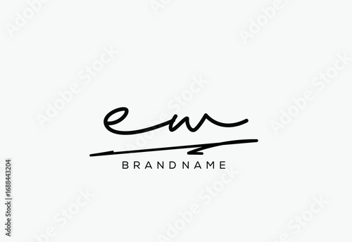 EW letter elegant cursive beauty handwriting logo.