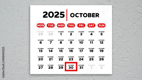 The date October 30th marked with a red cursor on the wall calendar 2025