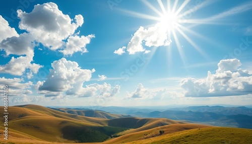 Azure sky, fluffy white clouds, vibrant sunshine illuminating rolling hills,  serene,  royalty free