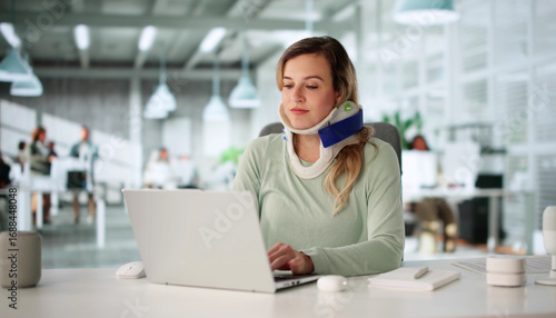 Fotografie Injured Worker Wearing Neck Brace Compensates