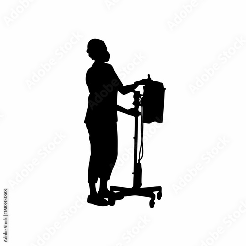 Dialysis technician setting up medical equipment for patient treatment