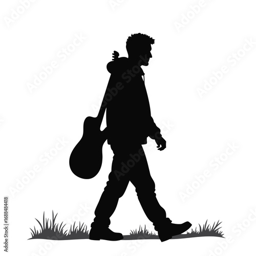 Black silhouette of a man walking with a guitar carrying
