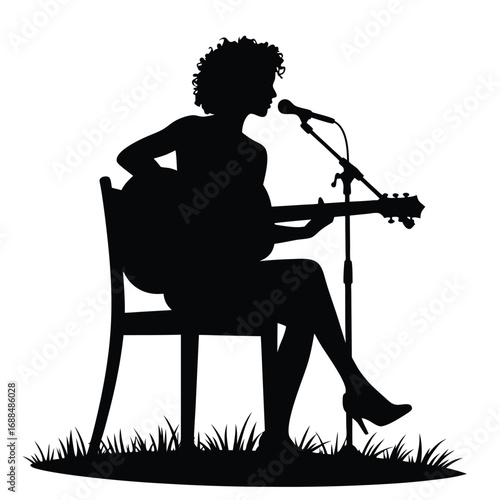 Black silhouette of a woman playing guitar and singing into a microphone