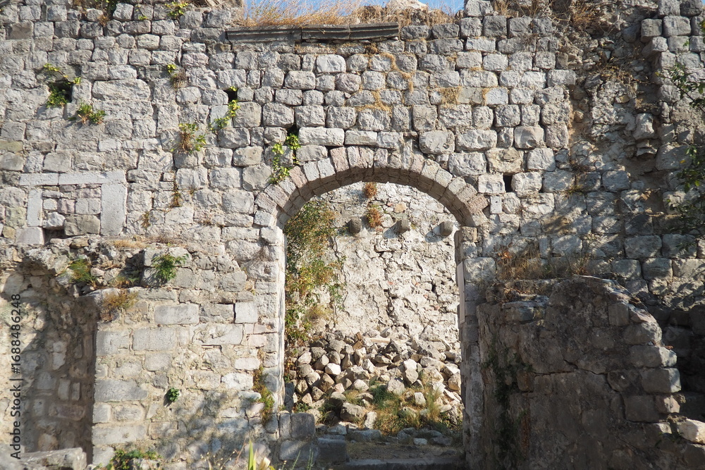 Fototapeta premium Exploring the storied ruins of Stari Bar, this site reveals remnants of ancient architecture nestled in Montenegro old town. Nature intertwines with history in this captivating location