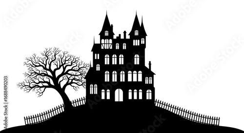 Spooky haunted house silhouette with bare tree and fence for Halloween or horror themes