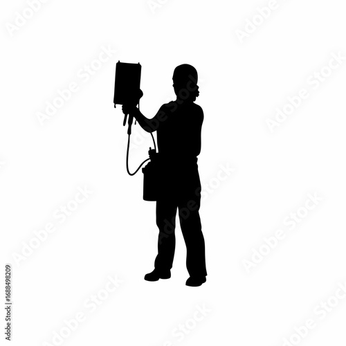 Silhouette of healthcare professional performing dialysis treatment