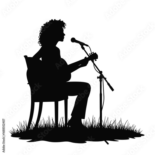 Silhouette of woman playing guitar and singing into microphone outdoors 1