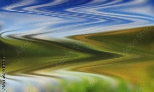 Abstract Wavy Lines of Blue Sky and Green Landscape Blended with Yellow Hues Creating a Distorted Natural Scene