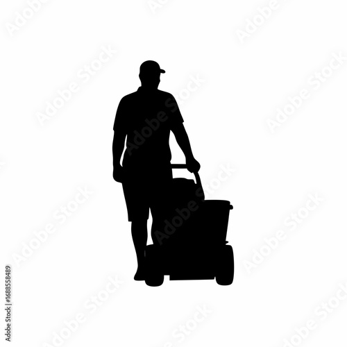 Silhouette of a worker operating a grape harvesting machine in a vineyard