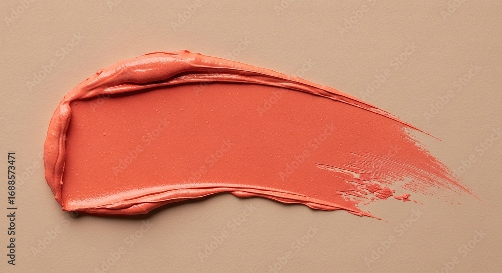 Fototapeta premium Swatch of Coral Lipstick on Beige Background, Detailed Texture a