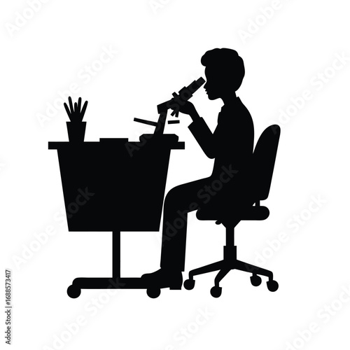 Silhouette of person using microscope at desk laboratory