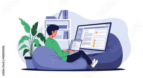 Young man working on laptops from home while sitting on a beanbag chair