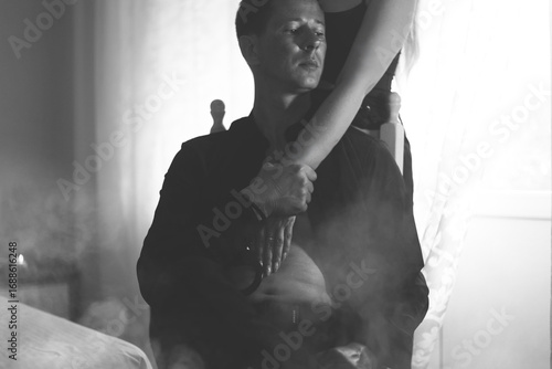 Couple during intimate moments in bedroom