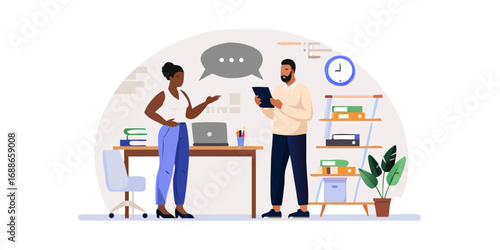 Diverse colleagues collaborating in an office discussing ideas using a tablet and laptop