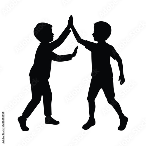 Two boys giving a high five silhouette
