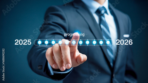 Businessman Touching Progress Bar Indicating Year Transition 2025 to 2026 image photo