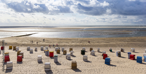 Panorama of traditional german beach chairs at the waterfront in Borkum