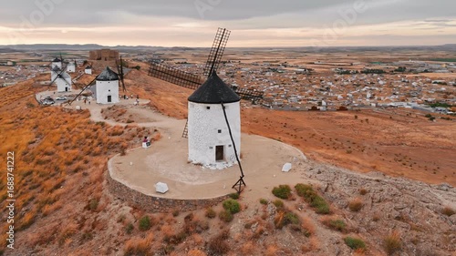Aerial view of the windmills of Consuegra at sunset, Castilla-La Mancha, Spain.