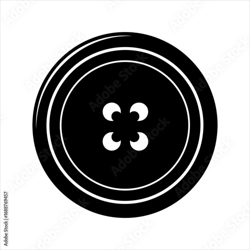 Black sewing button with four holes on white background clothing fastener